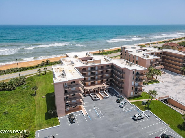 aerial view with a view of the beach and a water view