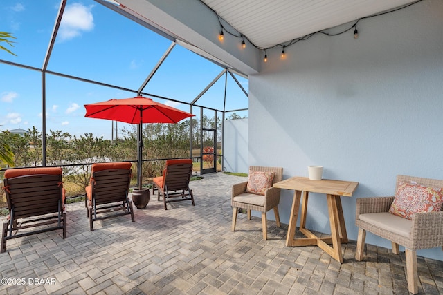 view of patio / terrace with a lanai