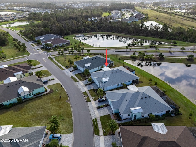 birds eye view of property featuring a water view