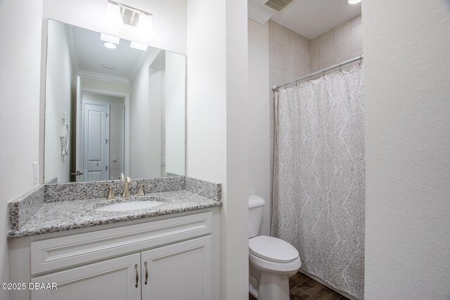 bathroom with toilet, a shower with curtain, wood-type flooring, ornamental molding, and vanity