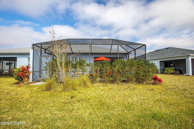 view of yard with glass enclosure