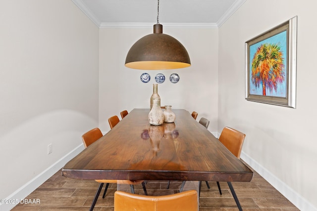 dining space featuring crown molding