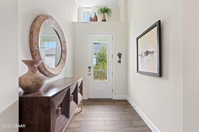 entryway featuring ornamental molding