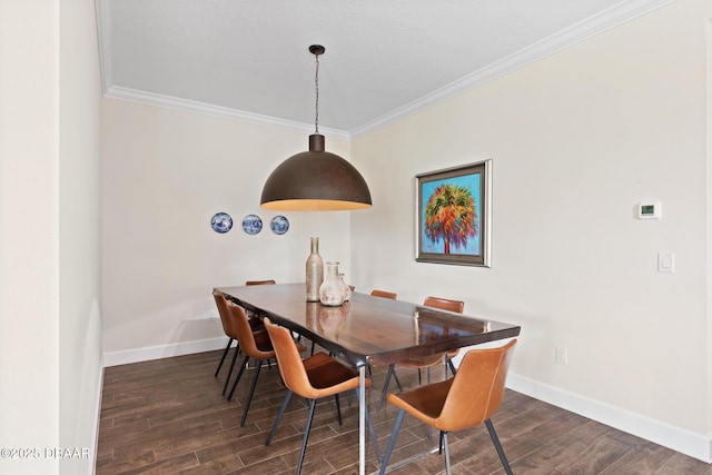 dining area featuring crown molding and dark hardwood / wood-style floors