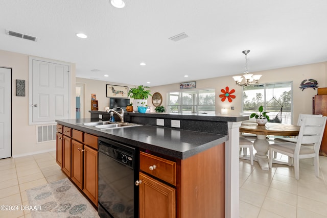 kitchen featuring dishwasher, decorative light fixtures, sink, and a center island with sink