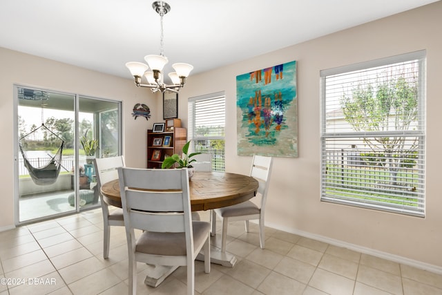 dining space with light tile patterned floors and plenty of natural light