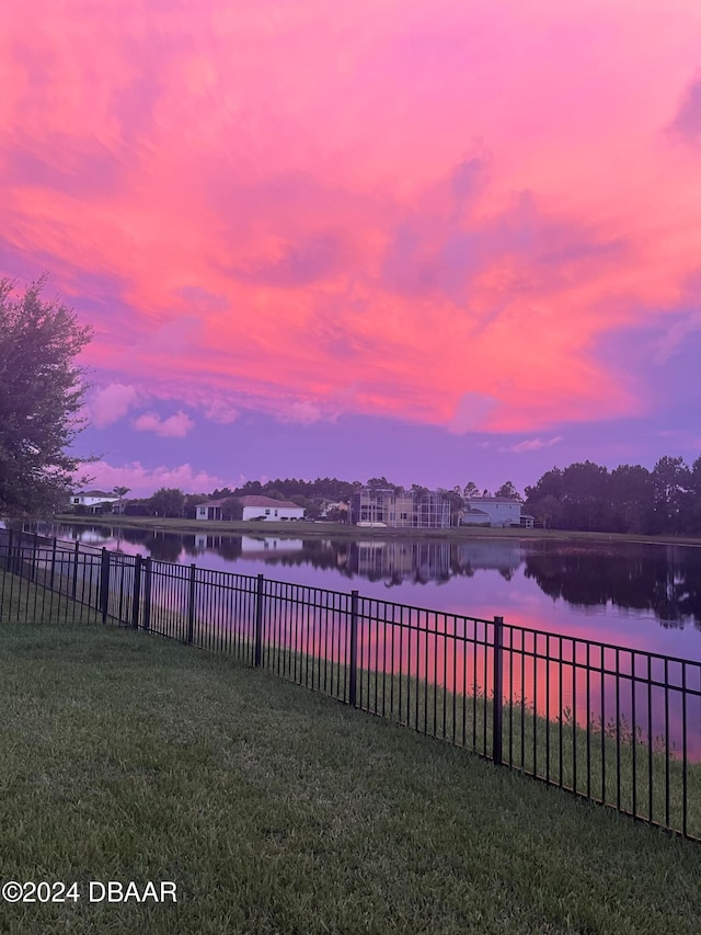 yard at dusk with a water view