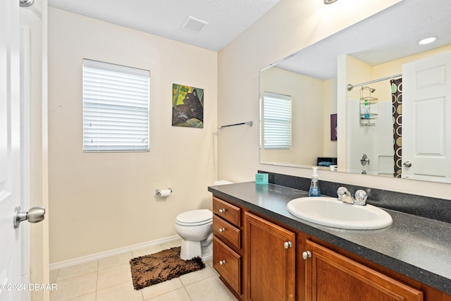 bathroom featuring vanity, a shower with shower curtain, tile patterned flooring, and toilet