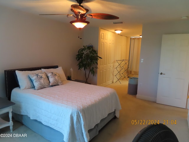 carpeted bedroom with ceiling fan