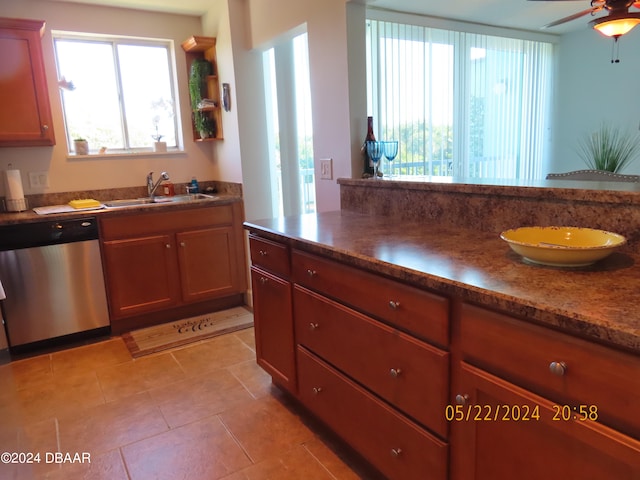 kitchen featuring stainless steel dishwasher, ceiling fan, and sink