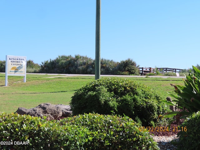 surrounding community with a lawn and a rural view