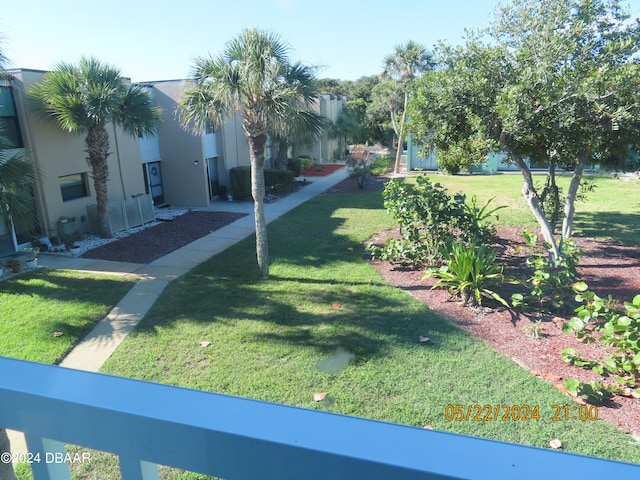 view of community featuring a yard