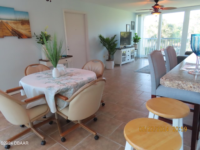 dining room featuring tile patterned floors and ceiling fan