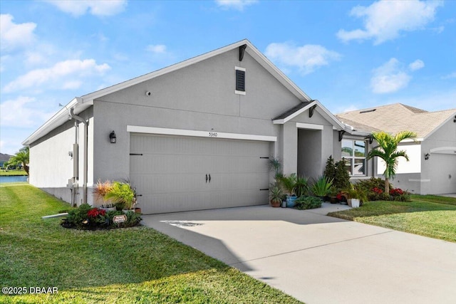 view of front of property featuring a garage and a front lawn