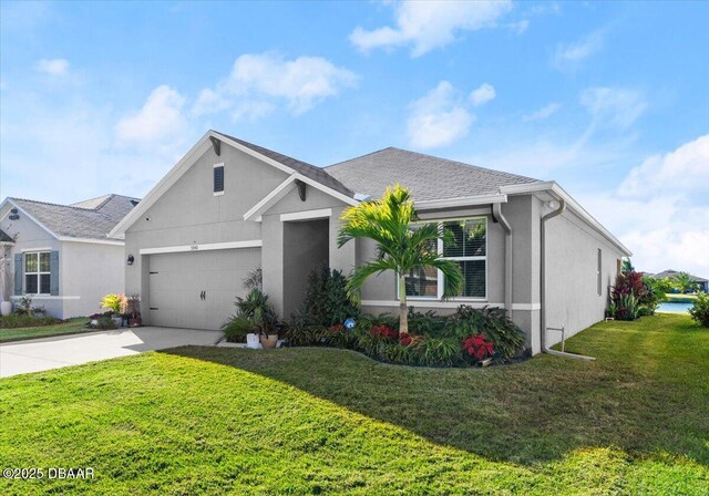 view of front of home with a garage and a front lawn