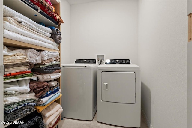 washroom with independent washer and dryer