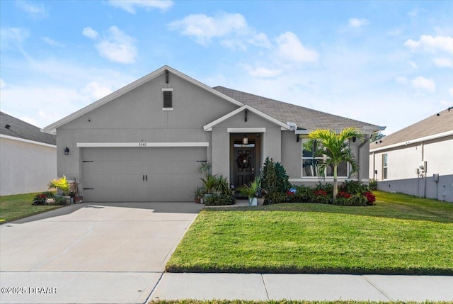 view of front facade with a garage and a front lawn