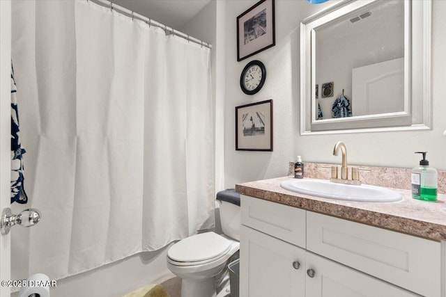 full bathroom featuring vanity, toilet, and shower / bath combo with shower curtain