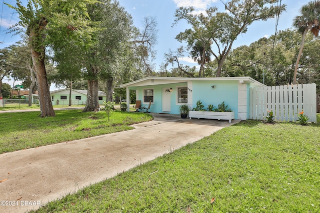 ranch-style house with a front lawn