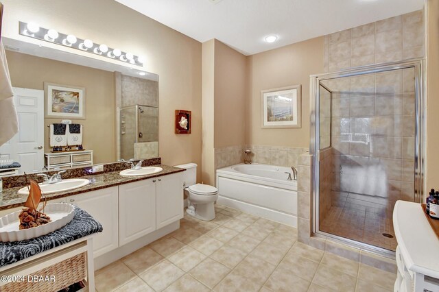 2 Oceans W Blvd Unit 204, Daytona Beach Shores, FL 32118 - full bathroom with double vanity, a shower stall, a bath, and tile patterned floors