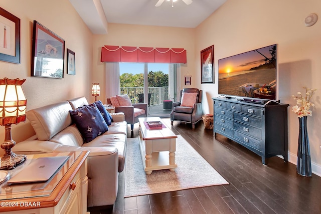 living room featuring dark hardwood / wood-style floors and ceiling fan