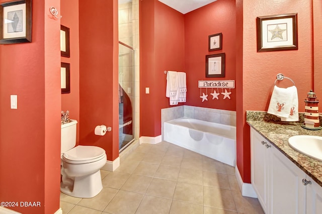 full bathroom featuring toilet, vanity, tile patterned floors, and plus walk in shower