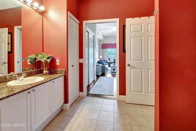 2 Oceans W Blvd Unit 204, Daytona Beach Shores, FL 32118 - bathroom with vanity, tile patterned flooring, and baseboards