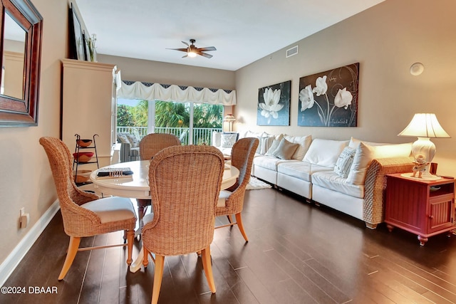 dining space featuring ceiling fan and dark hardwood / wood-style floors