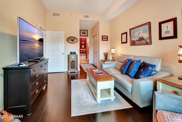 living room with dark hardwood / wood-style floors