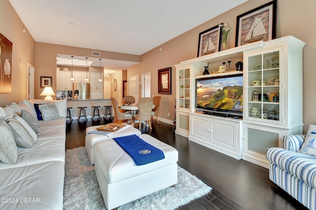 living room featuring dark hardwood / wood-style flooring