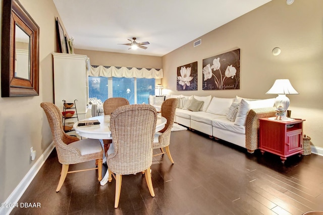 dining area featuring dark wood-type flooring and ceiling fan