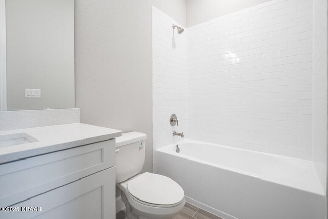 full bathroom featuring hardwood / wood-style floors, vanity, toilet, and tiled shower / bath combo