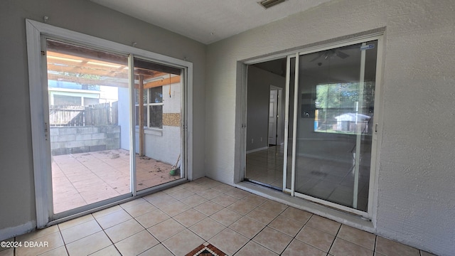 entryway with light tile patterned floors