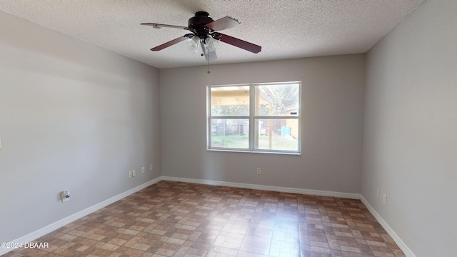 unfurnished room featuring a textured ceiling and ceiling fan