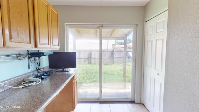 kitchen featuring light tile patterned flooring