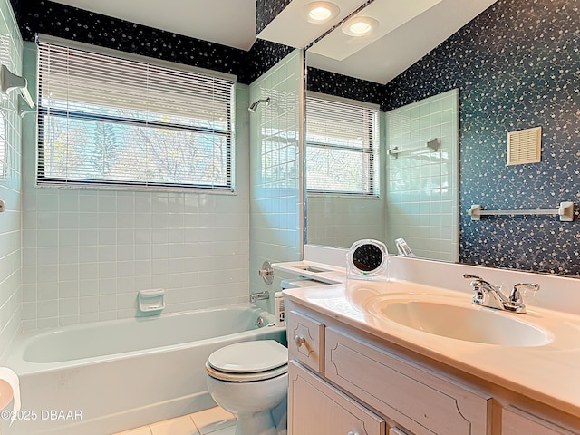 full bath with a wealth of natural light, toilet, tile patterned floors, and wallpapered walls