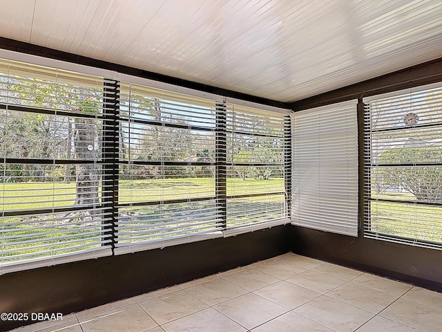 unfurnished sunroom with a wealth of natural light