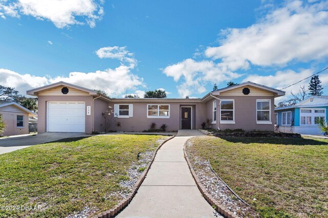 ranch-style house with a garage and a front yard