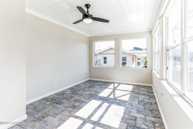 unfurnished sunroom with ceiling fan and wooden ceiling