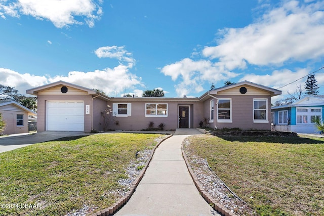 ranch-style home featuring a garage and a front yard