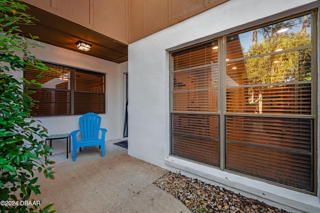 doorway to property with a patio area