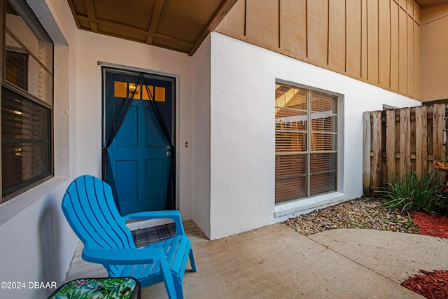 property entrance featuring a patio