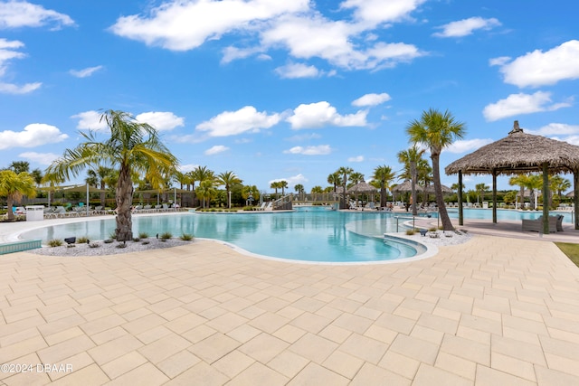 view of swimming pool featuring a patio area and a gazebo