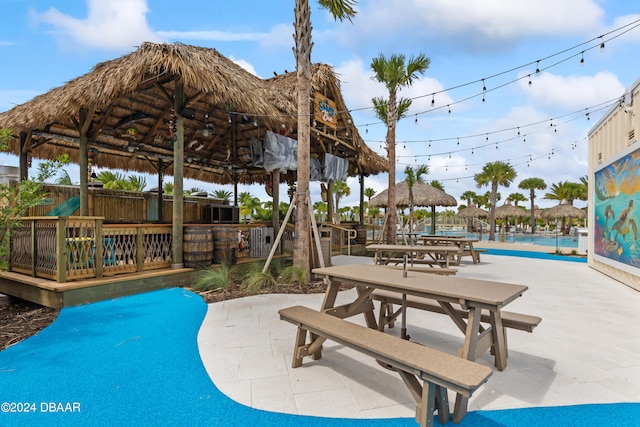 view of pool with a patio and a gazebo