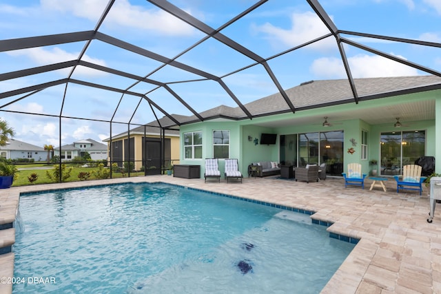 view of swimming pool featuring glass enclosure, an outdoor living space, a patio, and ceiling fan