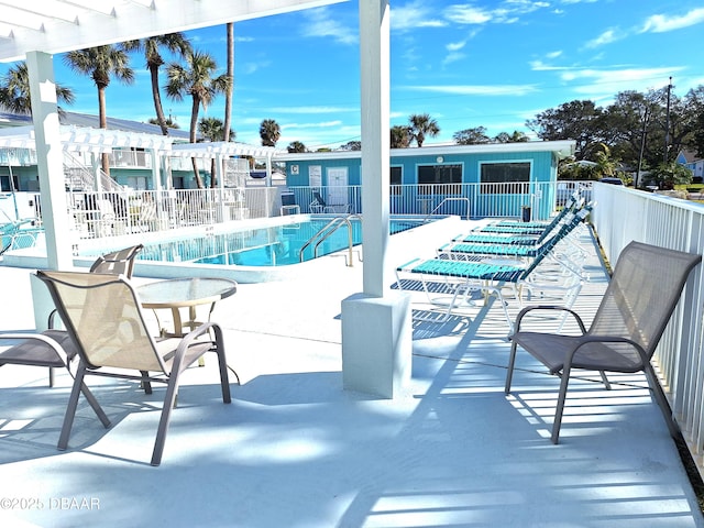 view of pool with a patio area and a pergola