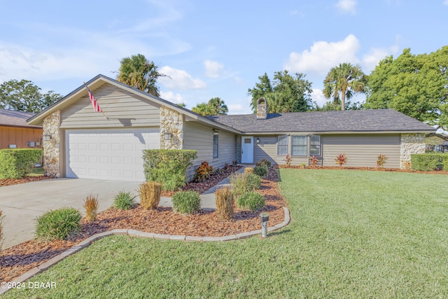 ranch-style house featuring a garage and a front lawn