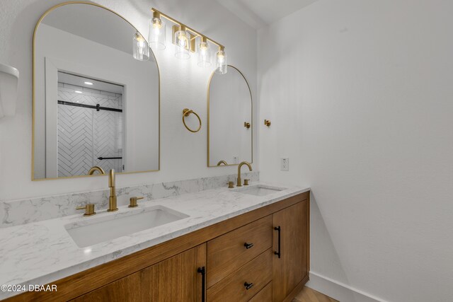 bathroom featuring vanity and a tile shower