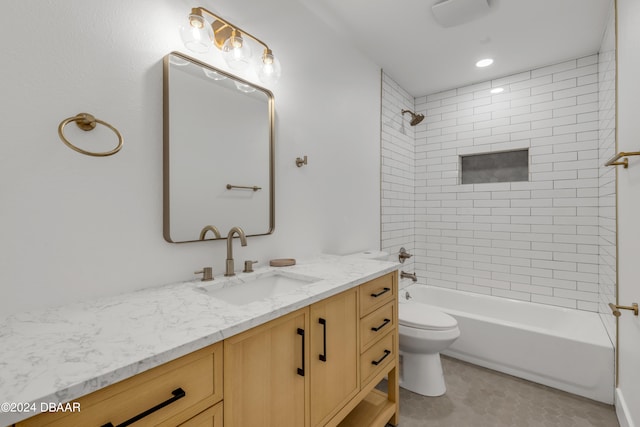 full bathroom featuring vanity, toilet, and tiled shower / bath combo