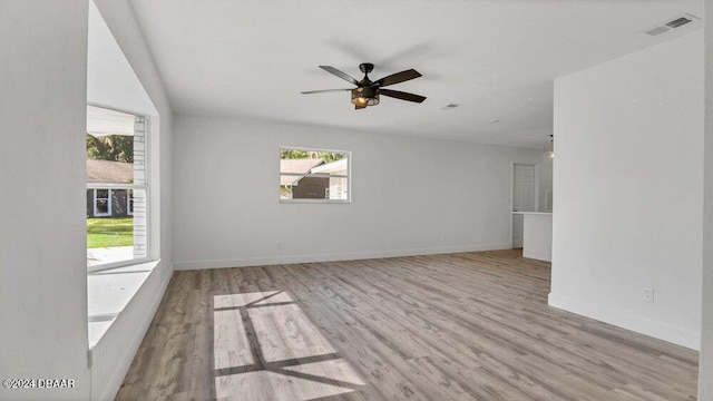 empty room featuring ceiling fan and light wood-type flooring